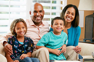 Smiling African American Family Thinking About Health Insurance